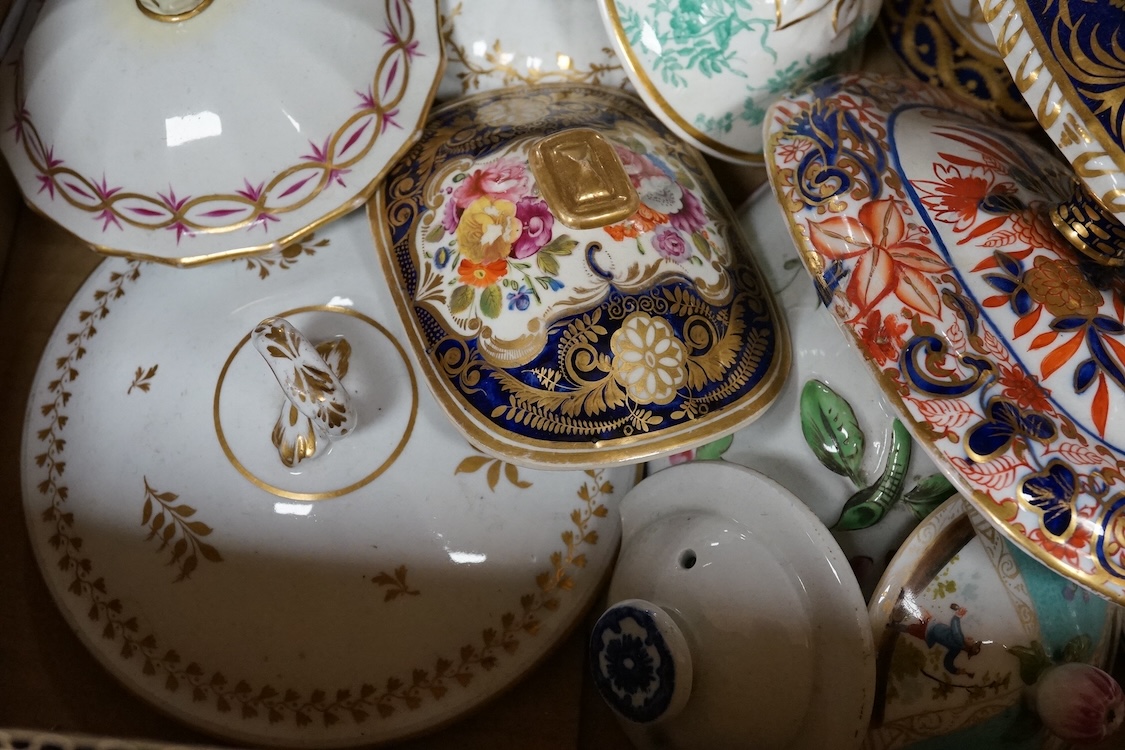 A collection of porcelain tureen and pot covers, largely 19th century